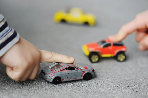 Innocence, childhood concept - playing with toy car — Stock Photo, Image
