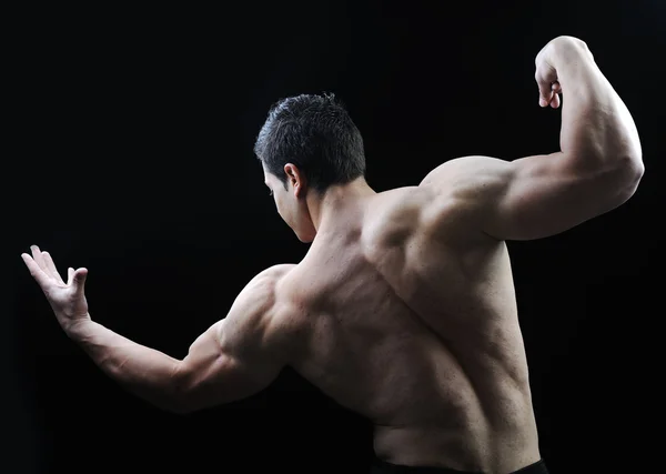 O corpo masculino perfeito - Impressionante fisiculturista posando — Fotografia de Stock