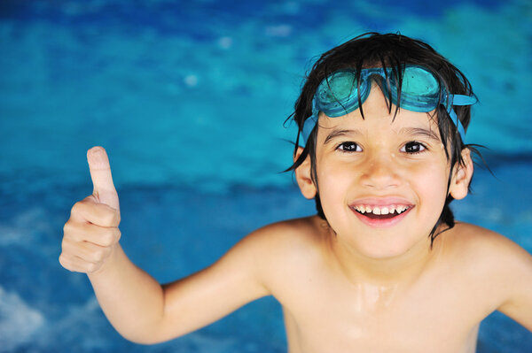 Summertime and swimming activities for happy children on the pool