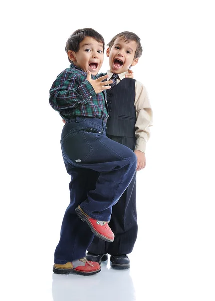 Glückliche Kinder mit modischer Kleidung isoliert — Stockfoto