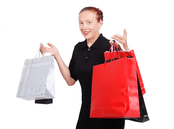 Femme blanche âgée avec des sacs pour faire du shopping — Photo