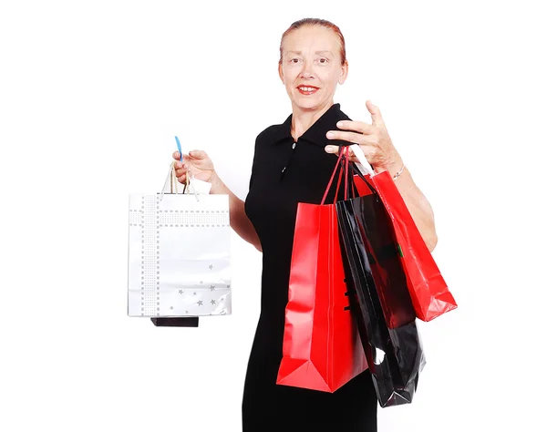 Donna anziana bianca con borse per lo shopping — Foto Stock