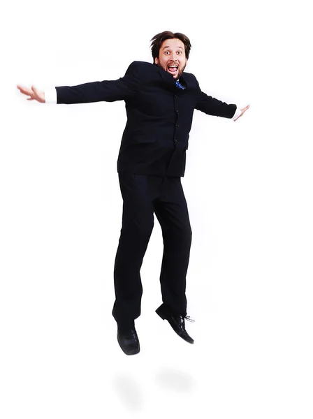Jovem homem atraente vestindo terno e pulando para cima — Fotografia de Stock