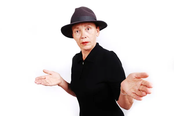 Senior woman in black clothes with gesture — Stock Photo, Image