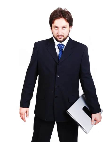 En attraktiv ung man i kostym med laptop — Stockfoto