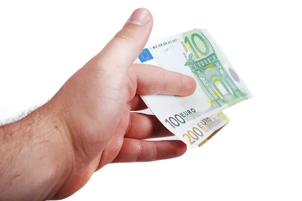 Мужская рука держит евро между пальцами — стоковое фото