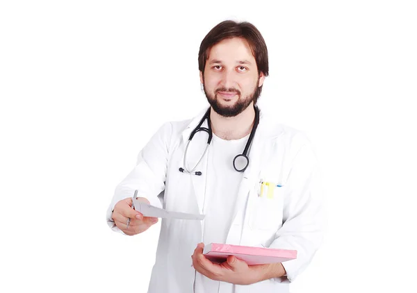 Young male doctor is preparing a receipt — Stock Photo, Image