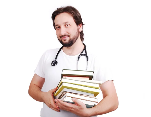 Νεαρό αρσενικό γιατρό με βιβλία στα χέρια — Φωτογραφία Αρχείου