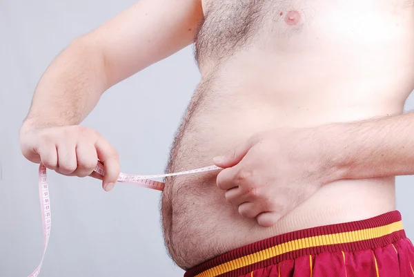 La medición del estómago, la dieta está en acción —  Fotos de Stock