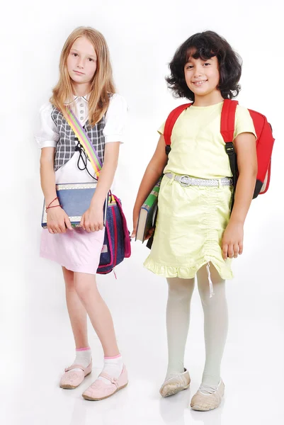 Dzieci w wieku szkolnym z torby i książek, na białym tle — Zdjęcie stockowe