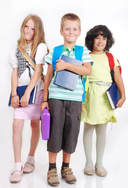 Crianças de escola com bolsas e livros, isoladas — Fotografia de Stock