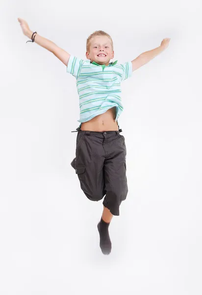 Mutlu çocuk atlama yüksek, izole — Stok fotoğraf