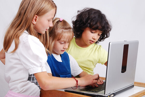 Children activities on laptop put on desk, isolated