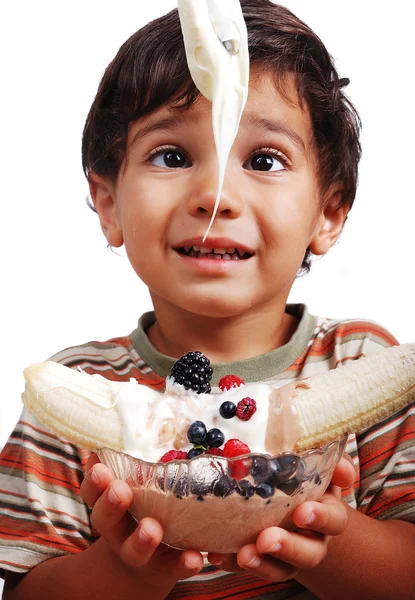 stock image Very cute kid is about to eat very sweet mixed fruint and cream