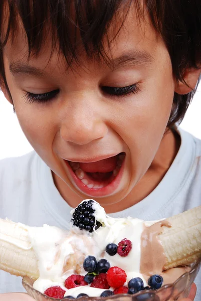 stock image Very cute kid is about to eat very sweet mixed fruint and cream