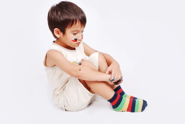 Little cute kid with colors on his face — Stock Photo, Image