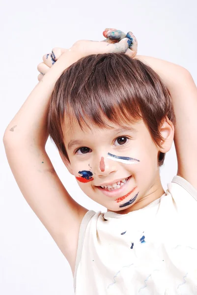 Little cute kid with colors on his face — Stock Photo, Image