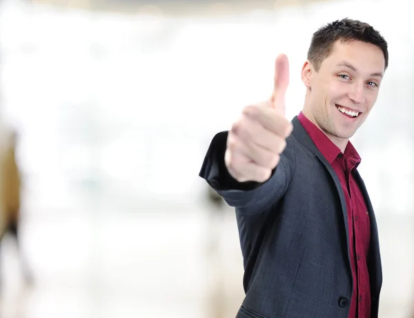 Young caucasian man showing thumbs up Royalty Free Stock Photos