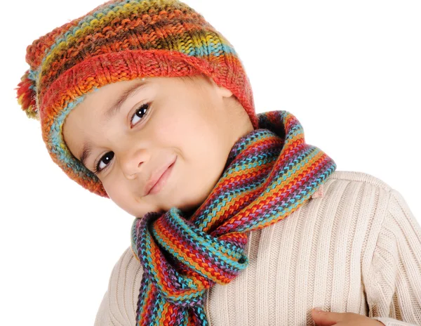 Cute kid with winter clothes isolated in studio Royalty Free Stock Images