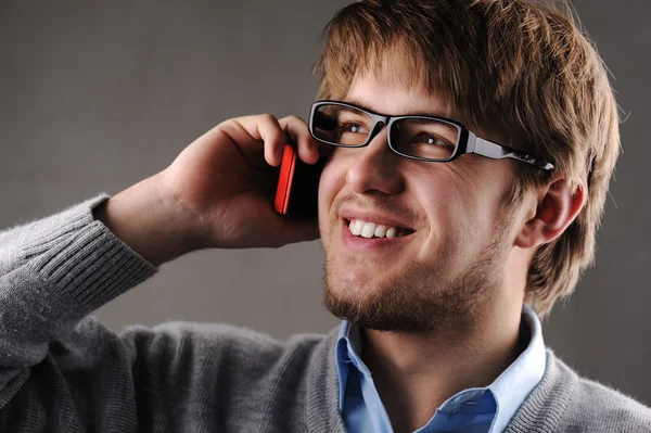 Young attractive man talking on cell phone Royalty Free Stock Images