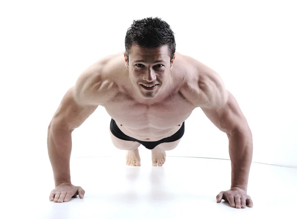 De perfecte mannelijke lichaam - awesome bodybuilder poseren Rechtenvrije Stockfoto's