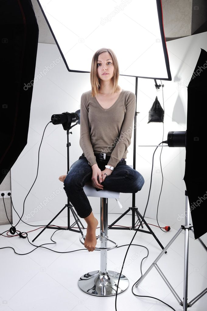 Young beautiful model posing in professionally equipped studio