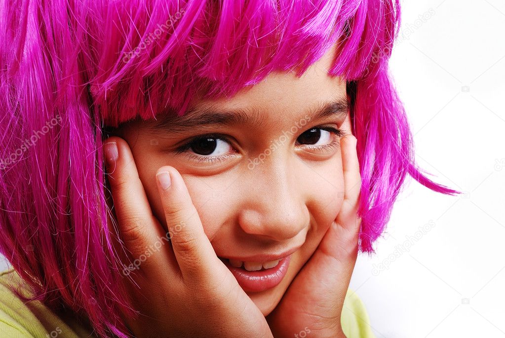 Adorable girl with pink hair and facial gesture