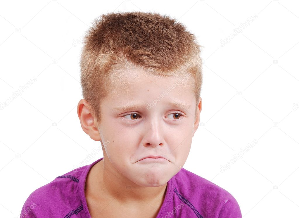 Very cute little boy with sad expression on face