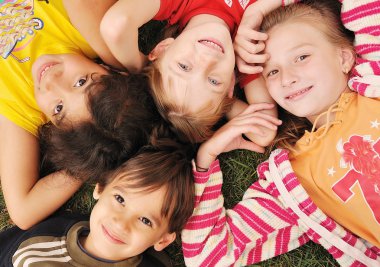 Small group of happy children outdoor clipart