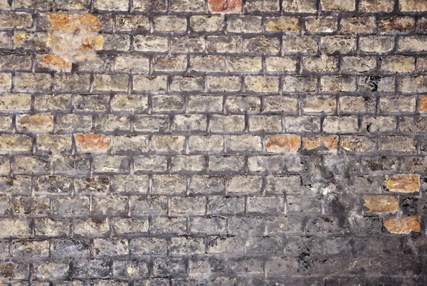 Uma parede antiga e característica, muro de tijolo colorido — Fotografia de Stock