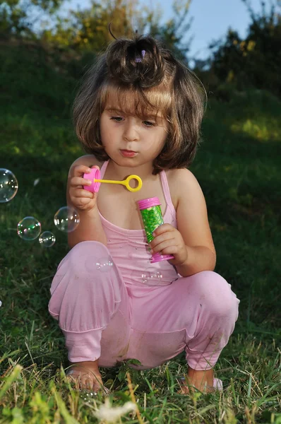 Happy childhood in summer outdoor, with bubbles — Stock Photo, Image