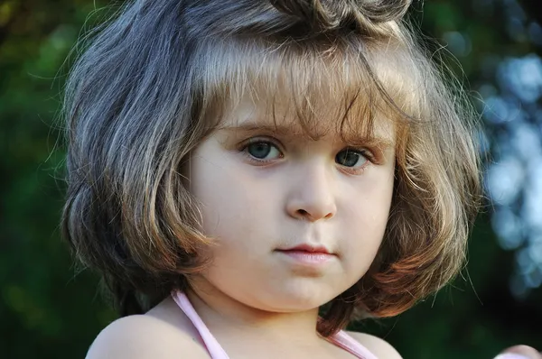 Very cute very little girl outdoor, close seup — стоковое фото