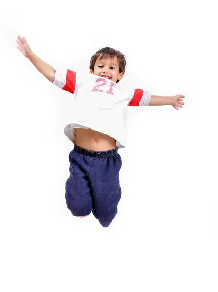 Çok mutlu küçük şirin çocuk atlıyor — Stok fotoğraf