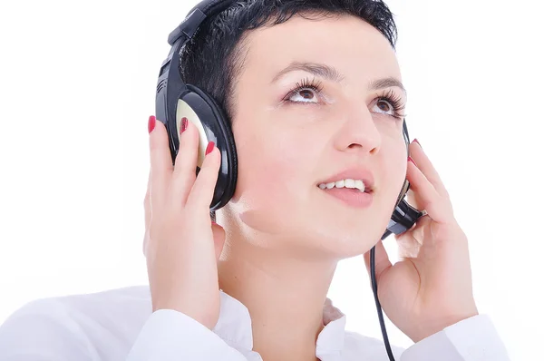 Junge schöne Frau mit Headset, die Musik hört — Stockfoto