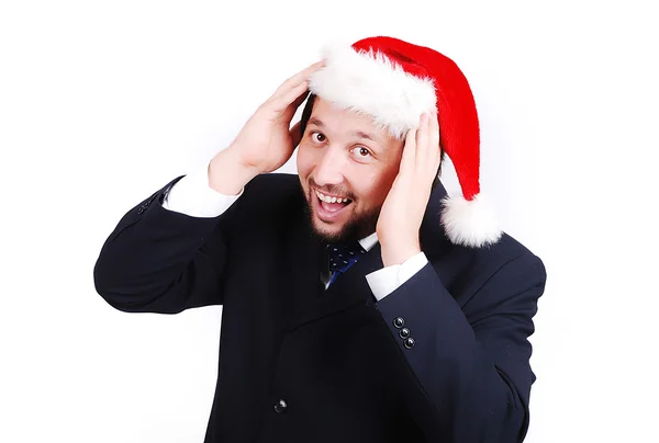 Giovane modello maschile in abito con cappello di Babbo Natale sulla testa — Foto Stock