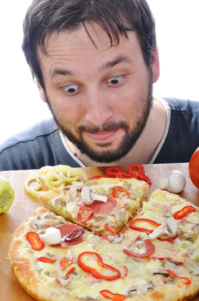 Adult person with surprised face on pizza table — Stock Photo, Image
