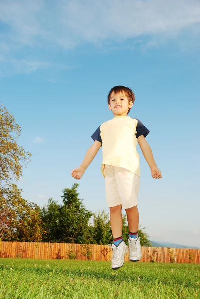 Very cute kid in beautiful clothes on outdoor scene — Stock Photo, Image