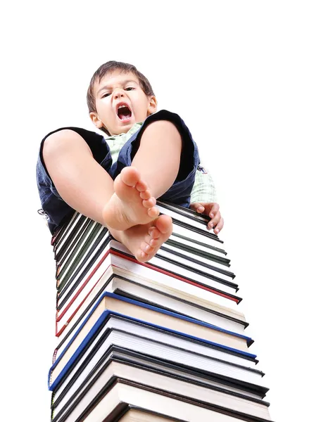 Boek toren gemaakt van vele boeken en persoon — Stockfoto