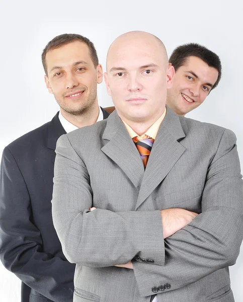 Gruppe junger Geschäftsleute zusammen auf hellem Hintergrund Stockbild