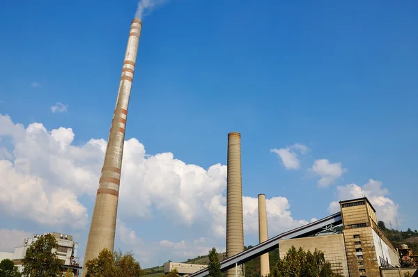 Two chimneys, industry, smoke against sky Royalty Free Stock Photos