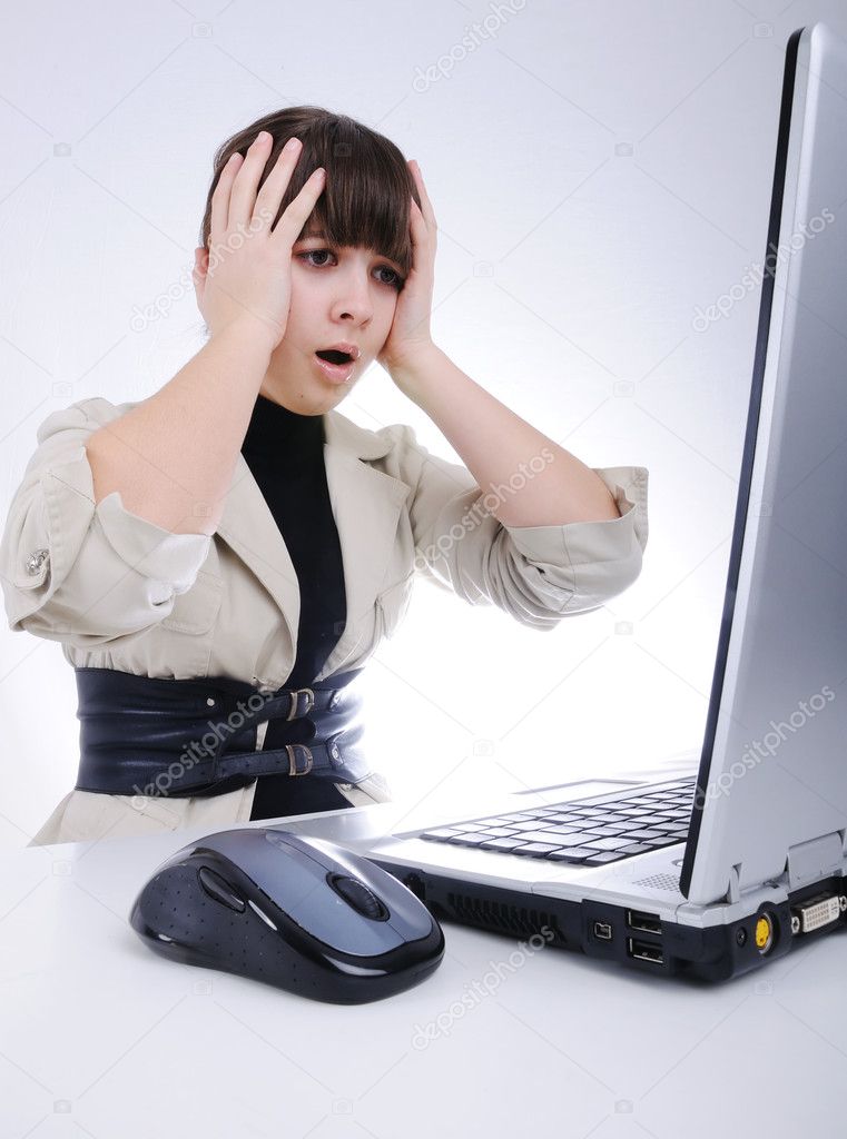 Shocked woman on laptop