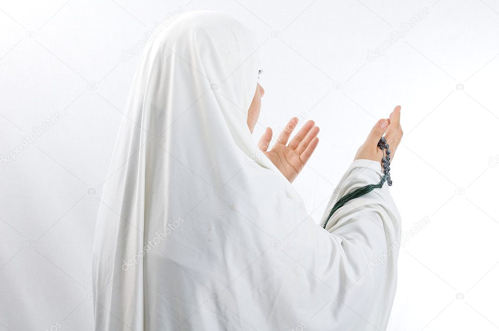 Veiled woman praying