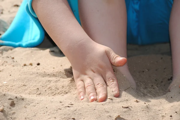 stock image Little hand playing in the sand