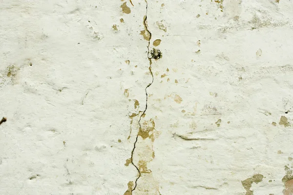 Gebarsten witte muur — Stockfoto
