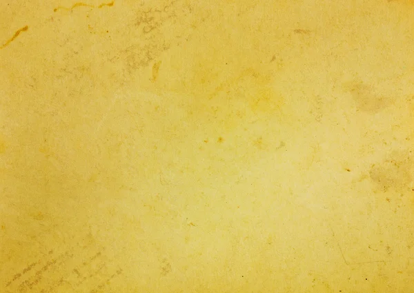 Золотая старая бумага с вырезанной фигурой — стоковое фото