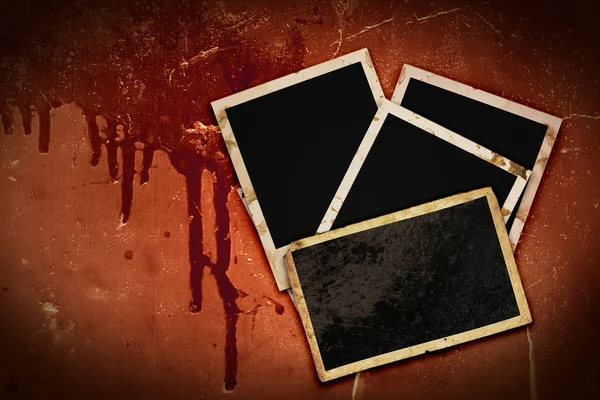 Photo frames on bloody grunge background — Stock Photo, Image