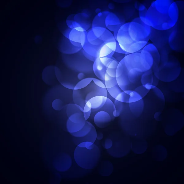 Círculos azules sobre un fondo oscuro —  Fotos de Stock