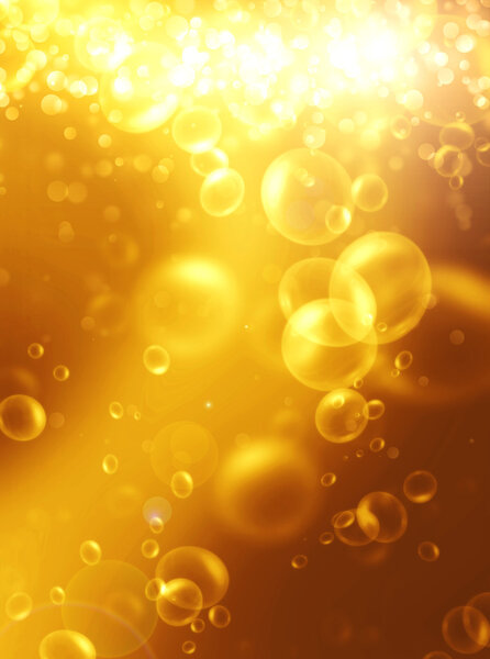 Beer bubbles on a bright gold background, abstract