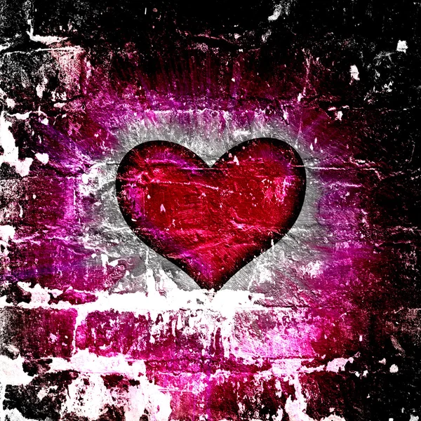 Červené srdce s paprsky na černém — Stock fotografie
