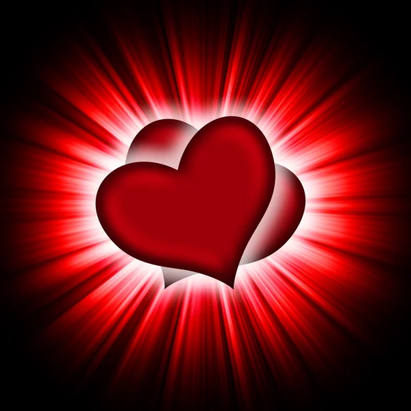 Červené srdce s paprsky na černém — Stock fotografie